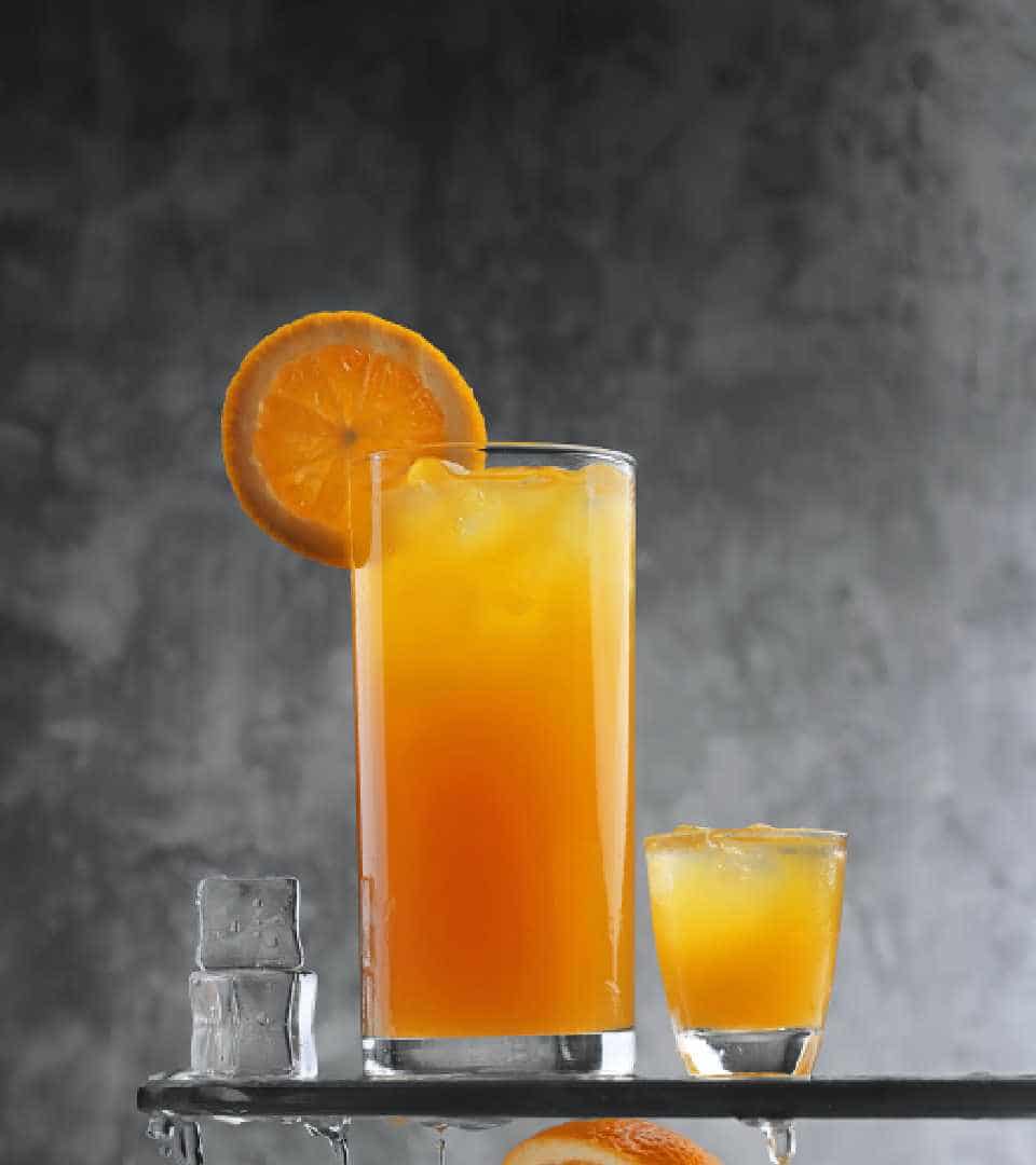 Addissinia Hotel, Breakfast Menu, a large glass of orange juice next to a small glass of orange juice